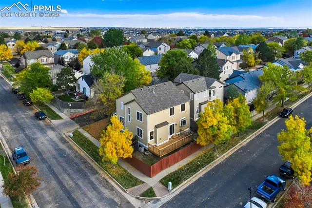 an aerial view of a house with a garden