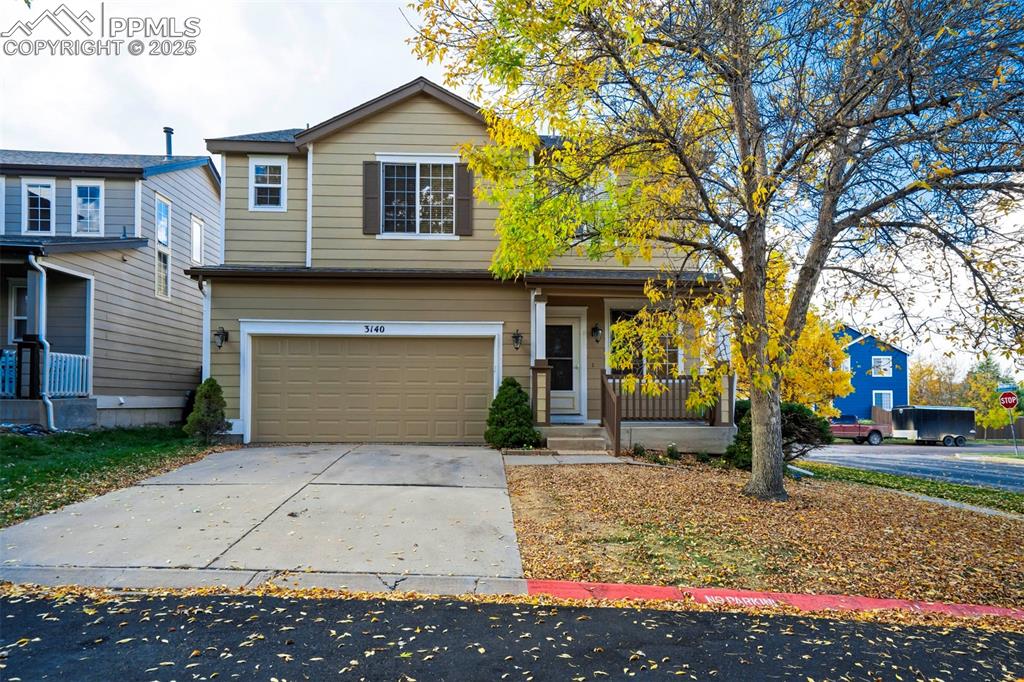 3140 River Valley View Colorado Springs, CO 80922 - Photo 42 of 49 a front view of a house with a yard and trees