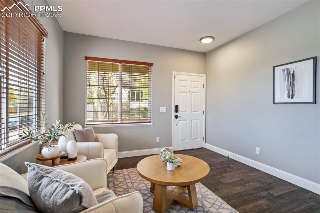 3140 River Valley View Colorado Springs, CO 80922 - Photo 5 of 49 a living room with furniture and a table
