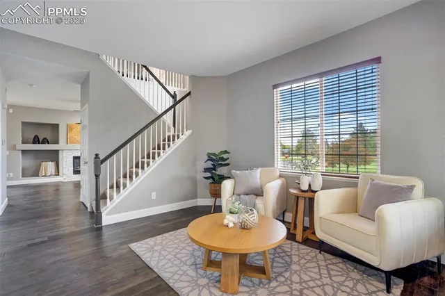 a living room with furniture and a table