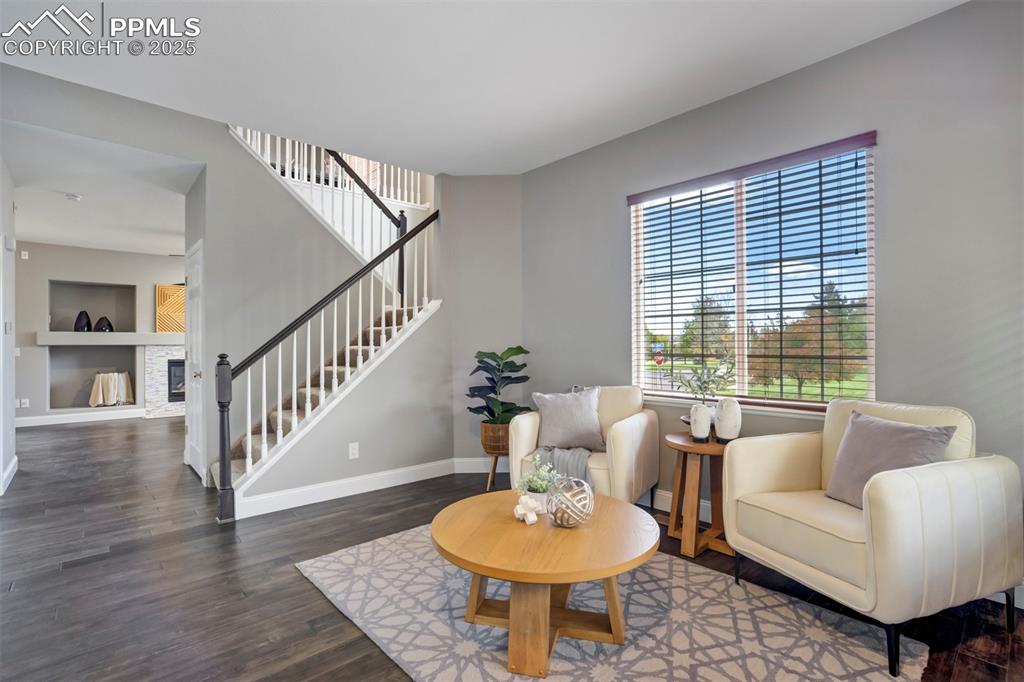 3140 River Valley View Colorado Springs, CO 80922 - Photo 6 of 49 a living room with furniture and a table