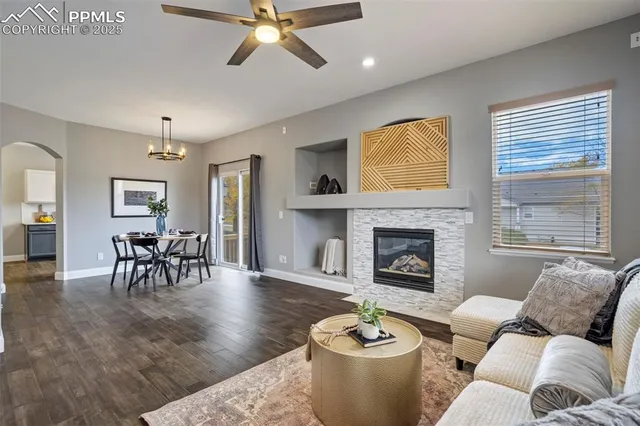 a living room with furniture and a fireplace