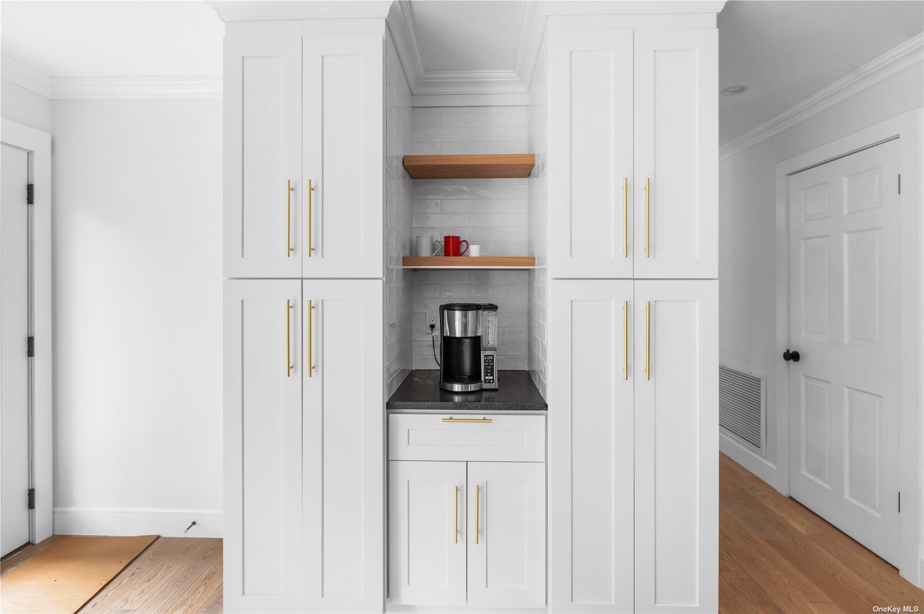 870 Stars Road East Marion, NY 11939 - Photo 12 of 23 a view of a closet area with cabinets
