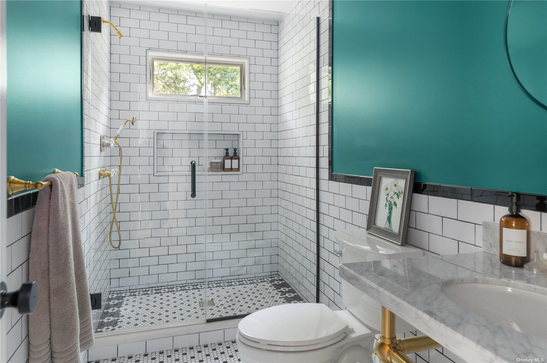 870 Stars Road East Marion, NY 11939 - Photo 15 of 23 a bathroom with a sink a toilet and shower