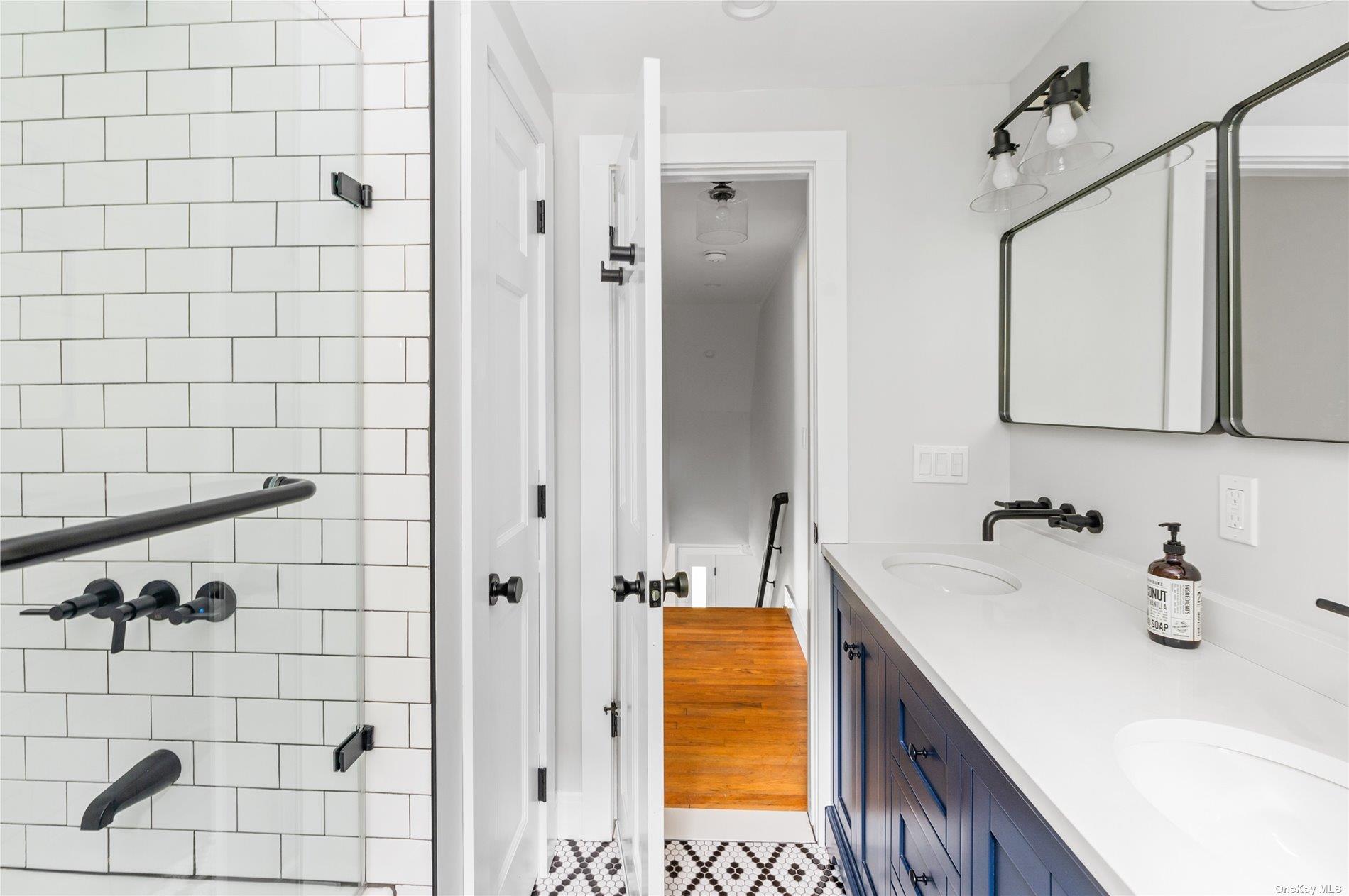 870 Stars Road East Marion, NY 11939 - Photo 17 of 23 a bathroom with a sink and a shower