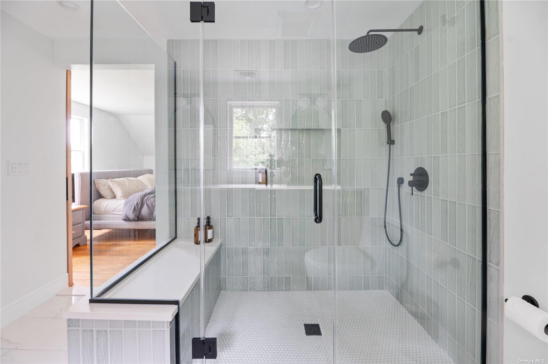 870 Stars Road East Marion, NY 11939 - Photo 19 of 23 a bathroom with a bath tub and shower