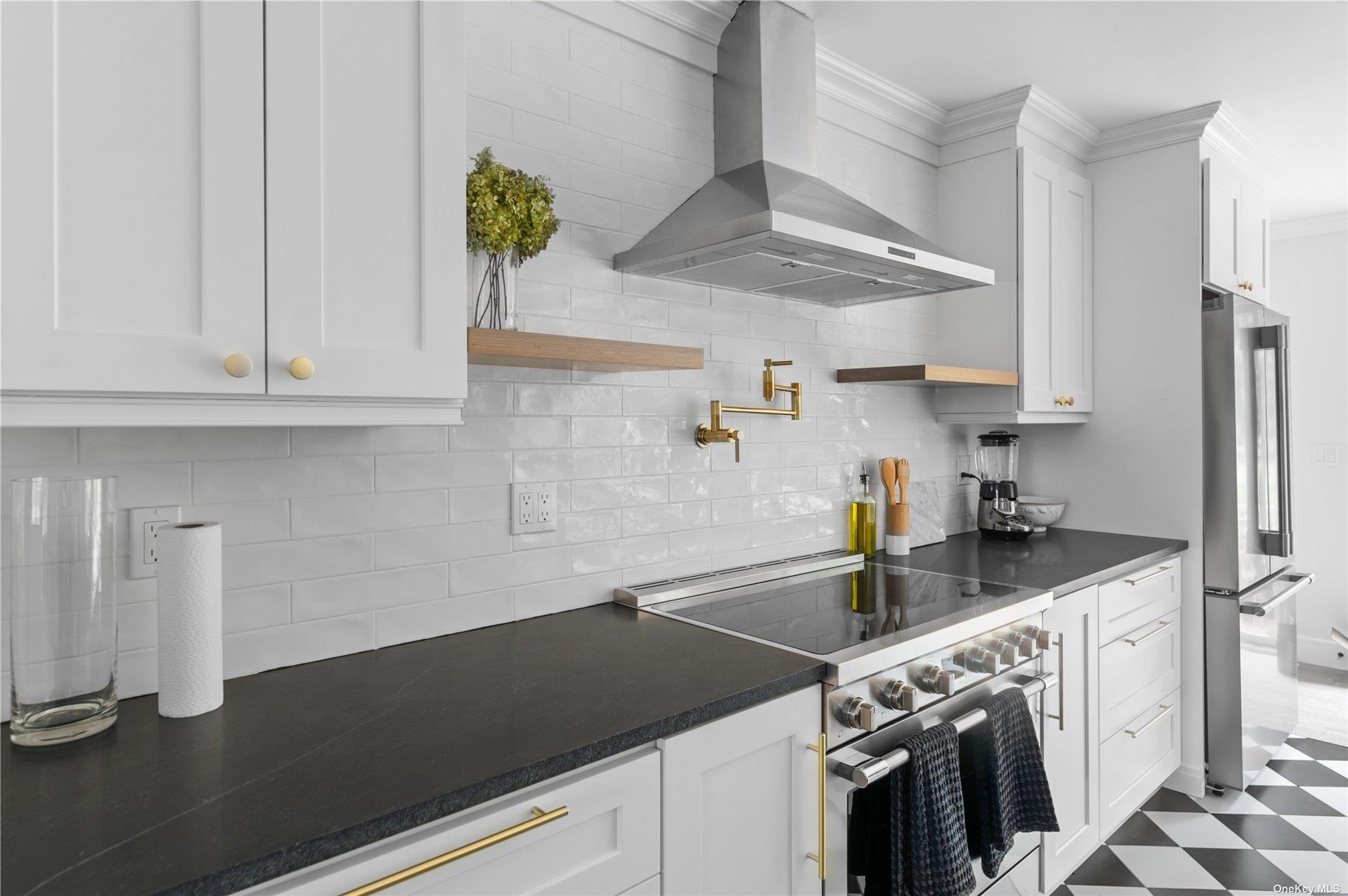 870 Stars Road East Marion, NY 11939 - Photo 3 of 23 a kitchen with a sink a stove and cabinets