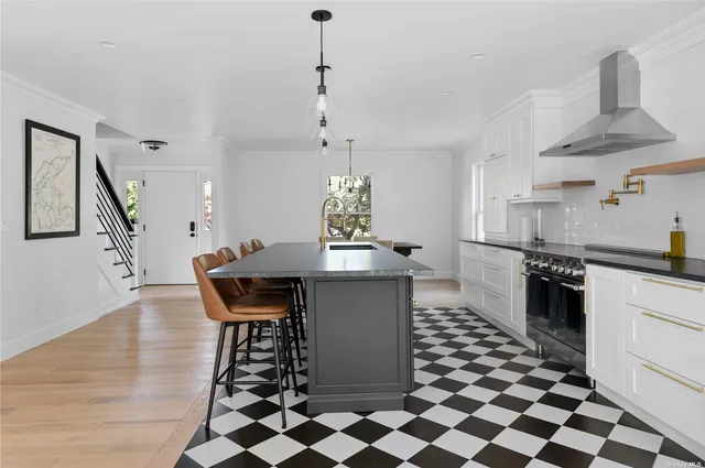 a kitchen with a table and chairs in it