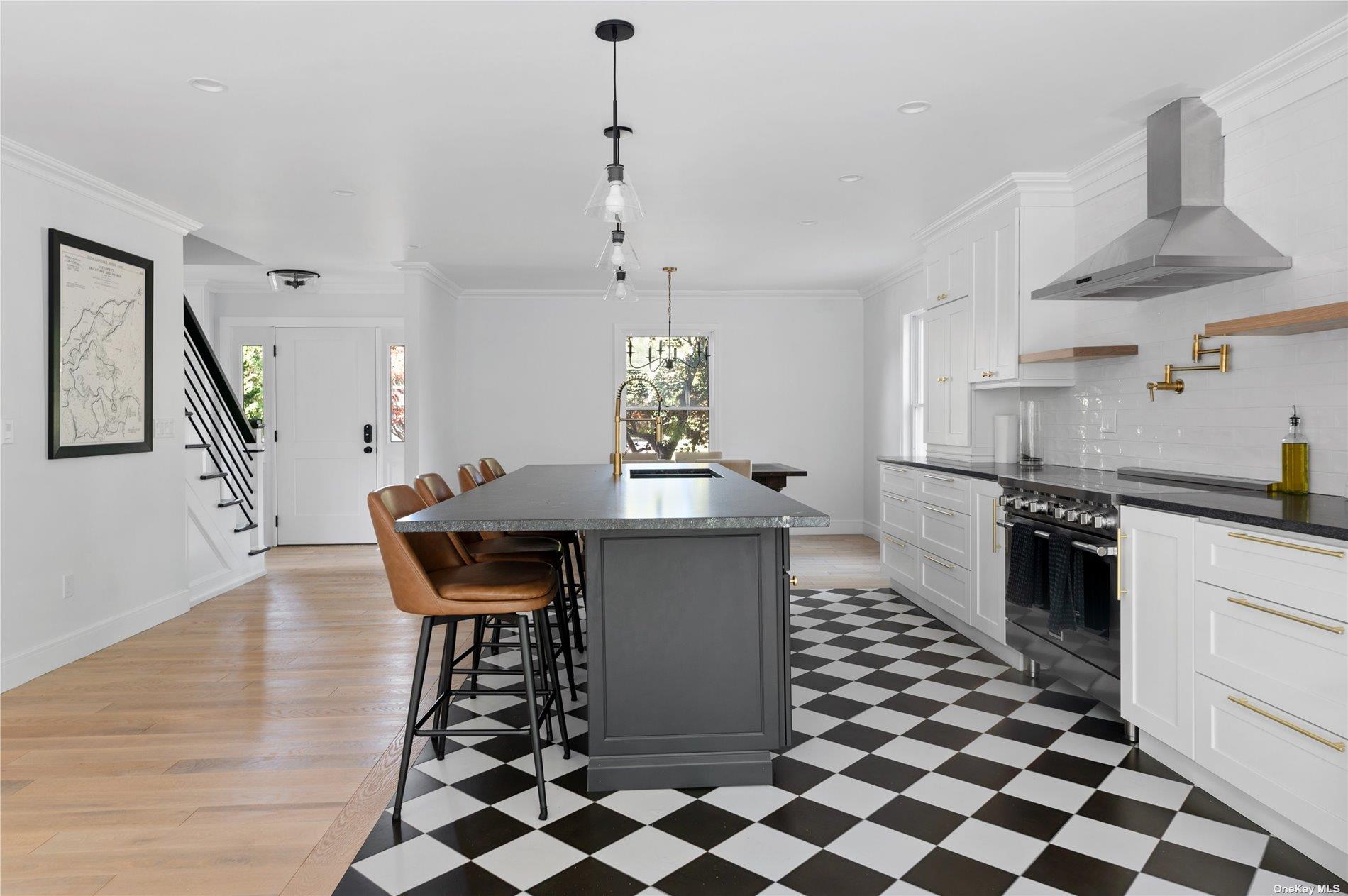 870 Stars Road East Marion, NY 11939 - Photo 7 of 23 a kitchen with stainless steel appliances a sink a stove a refrigerator and cabinets