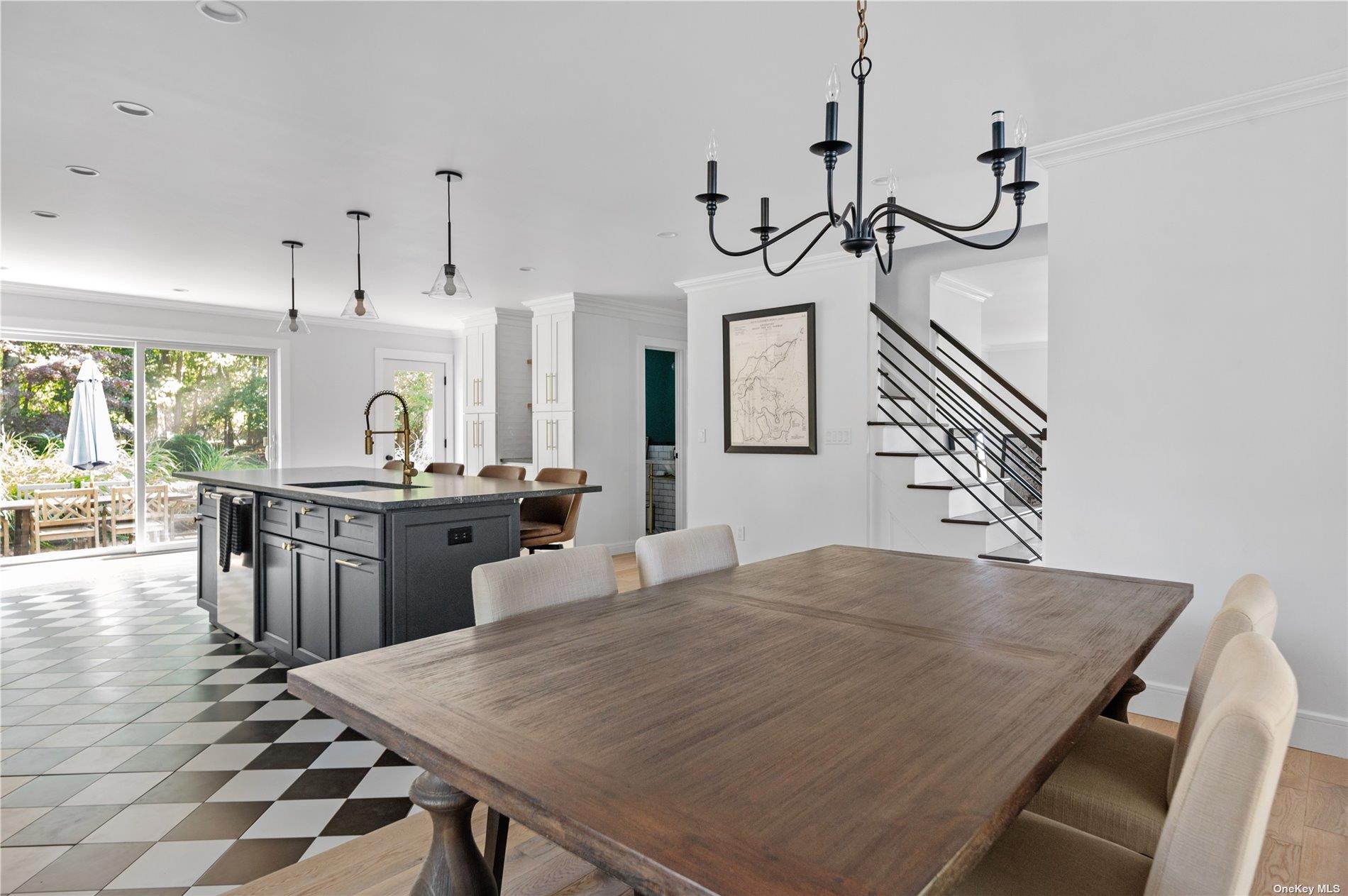 870 Stars Road East Marion, NY 11939 - Photo 8 of 23 a kitchen with a table and chairs in it