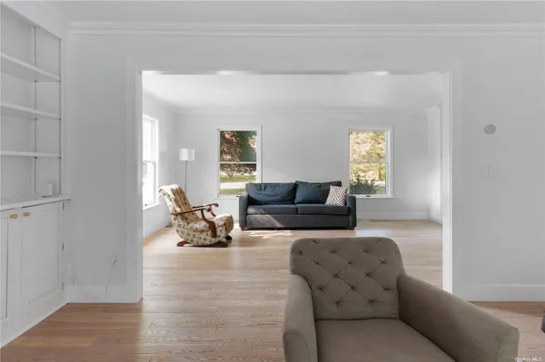 a view of a room with a table and chairs
