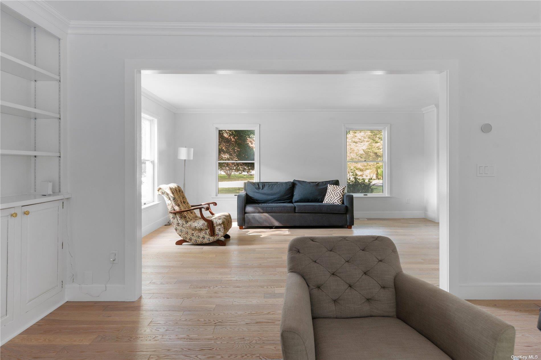 870 Stars Road East Marion, NY 11939 - Photo 10 of 23 a living room with furniture and a potted plant