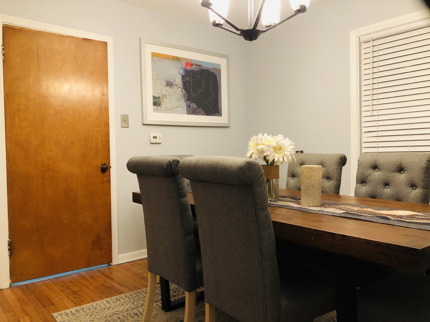 9044 South Merrill Avenue Chicago, IL 60617 - Photo 17 of 46 a dining room with furniture and wooden floor