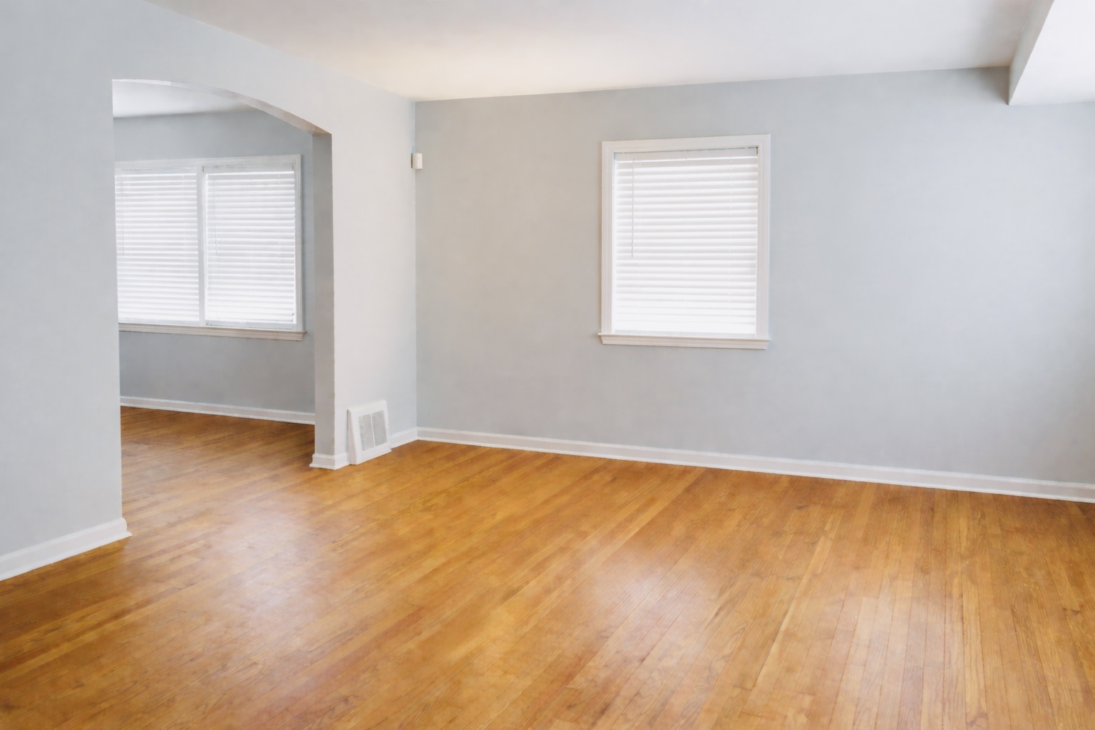 9044 South Merrill Avenue Chicago, IL 60617 - Photo 20 of 46 an empty room with wooden floor and windows