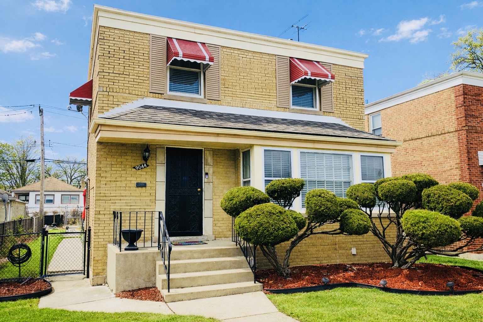 9044 South Merrill Avenue Chicago, IL 60617 - Photo 2 of 46 a front view of a house