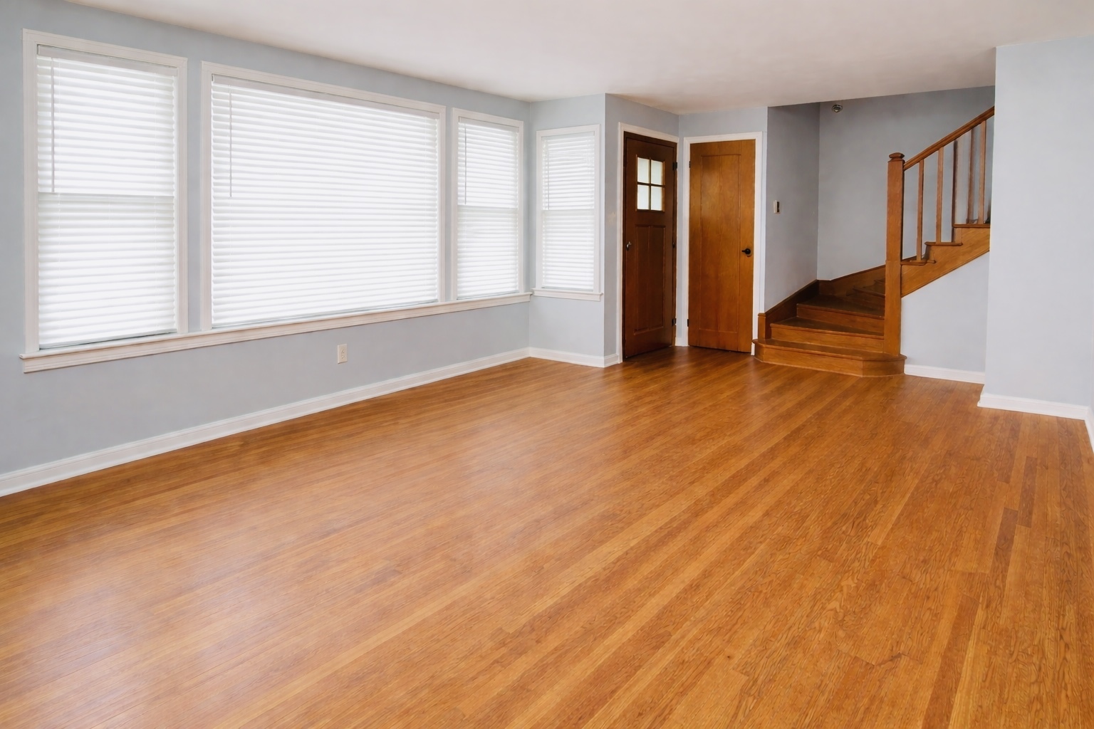 9044 South Merrill Avenue Chicago, IL 60617 - Photo 24 of 46 an empty room with wooden floor and windows