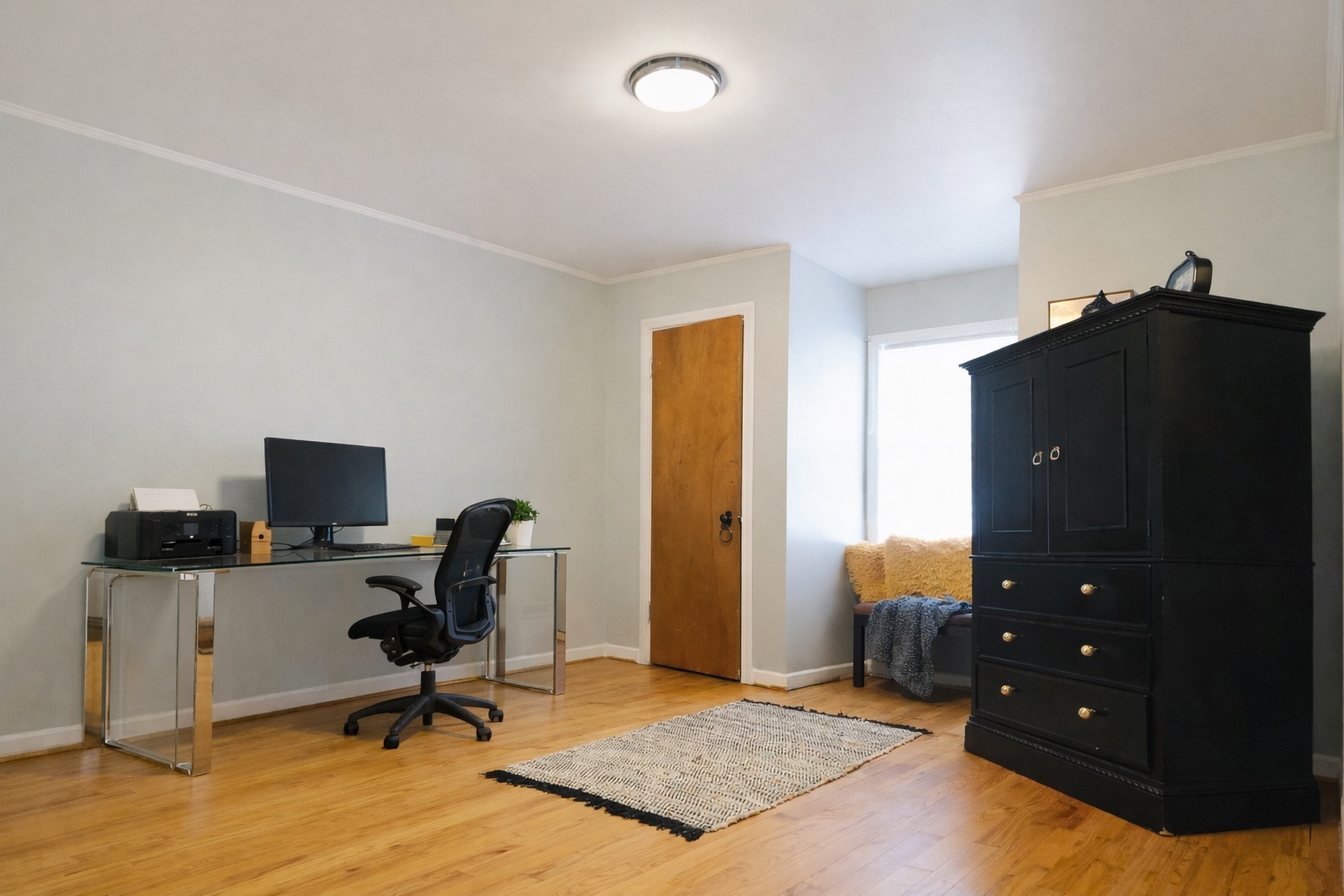 9044 South Merrill Avenue Chicago, IL 60617 - Photo 28 of 46 a view of a workspace with furniture and a window