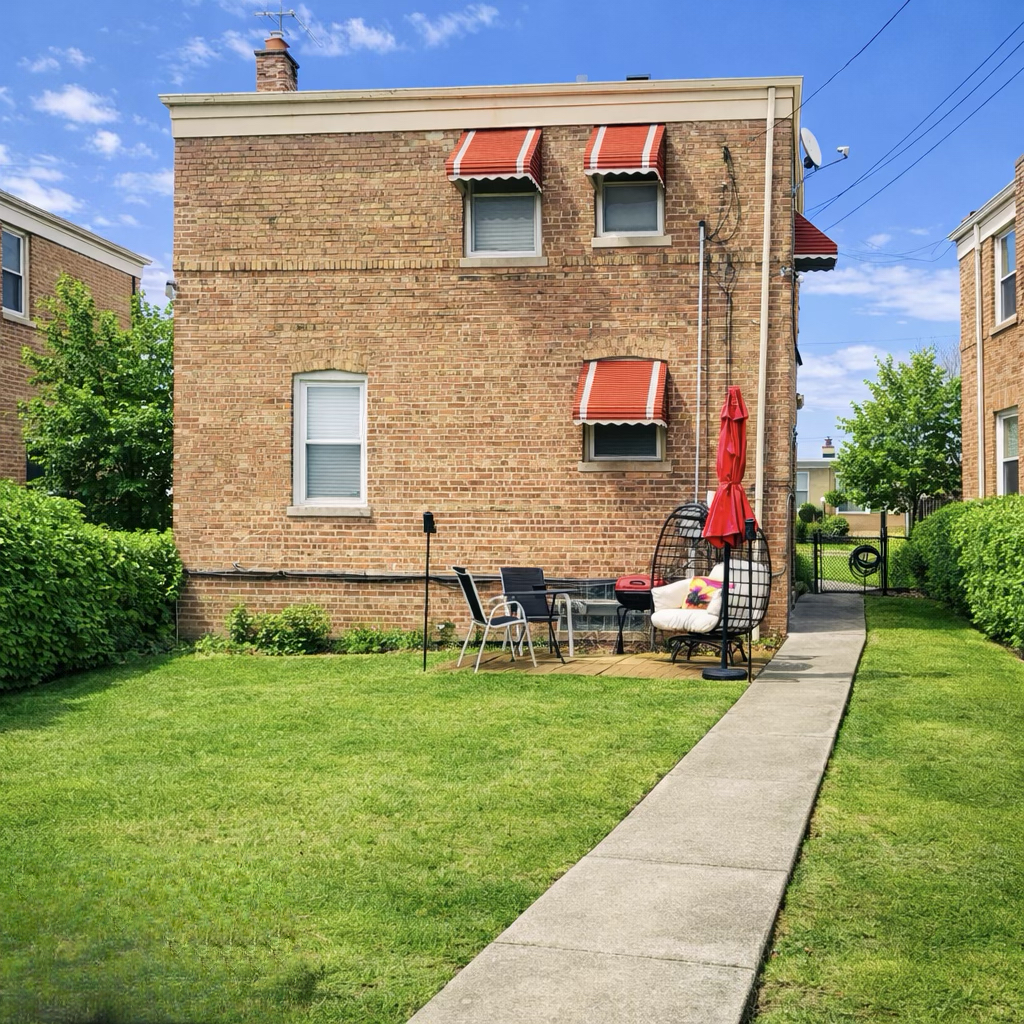 9044 South Merrill Avenue Chicago, IL 60617 - Photo 44 of 46 a front view of house with yard