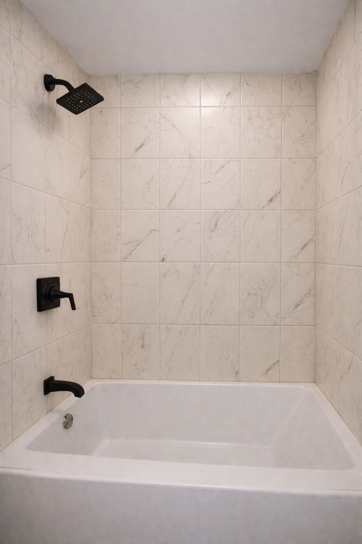 9044 South Merrill Avenue Chicago, IL 60617 - Photo 9 of 46 a bathroom with a bathtub