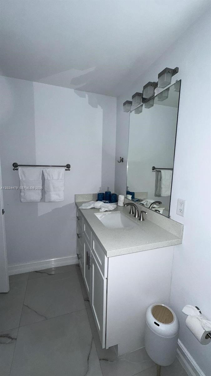 2212 Club House Road North Fort Myers, FL 33917 - Photo 20 of 40 a bathroom with a sink toilet and a mirror