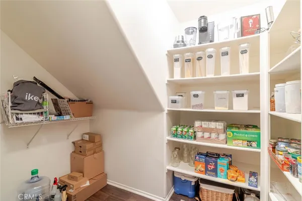 a shelf with books and knick knacks on it
