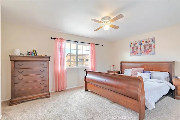 a bedroom with a bed and a cabinets