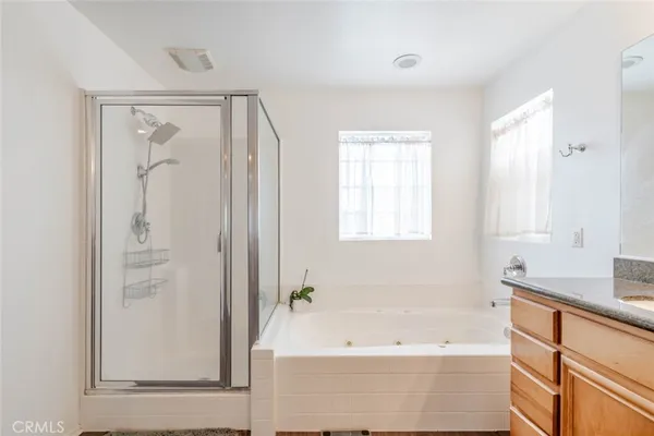a bathroom with a bathtub and a sink