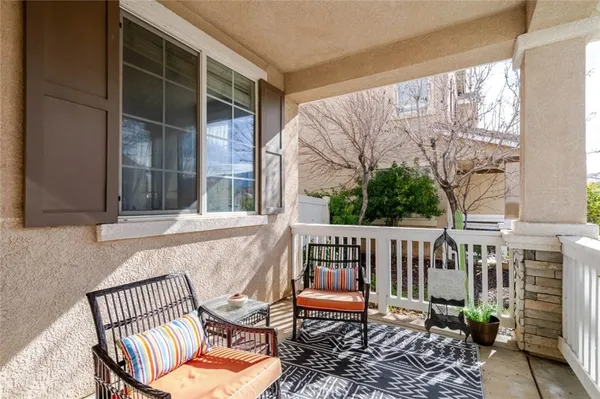 a view of porch with a bench