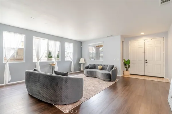 a living room with furniture and a large window