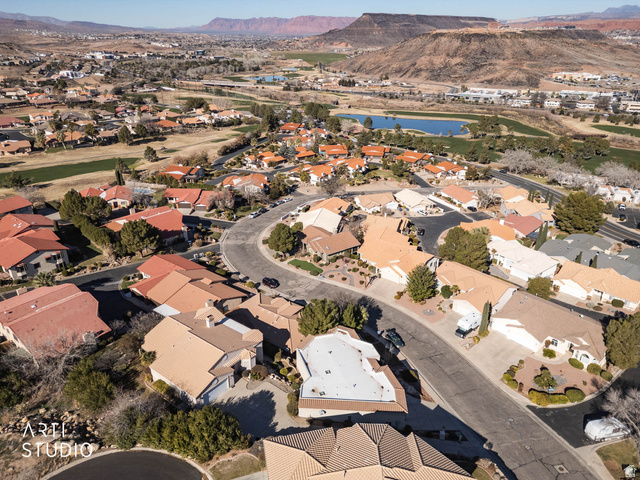 2158 Balboa Way St. George, UT 84770 - Photo 36 of 40 Aerial view of property and surrounding area featuring a water and mountain view and nearby suburban area