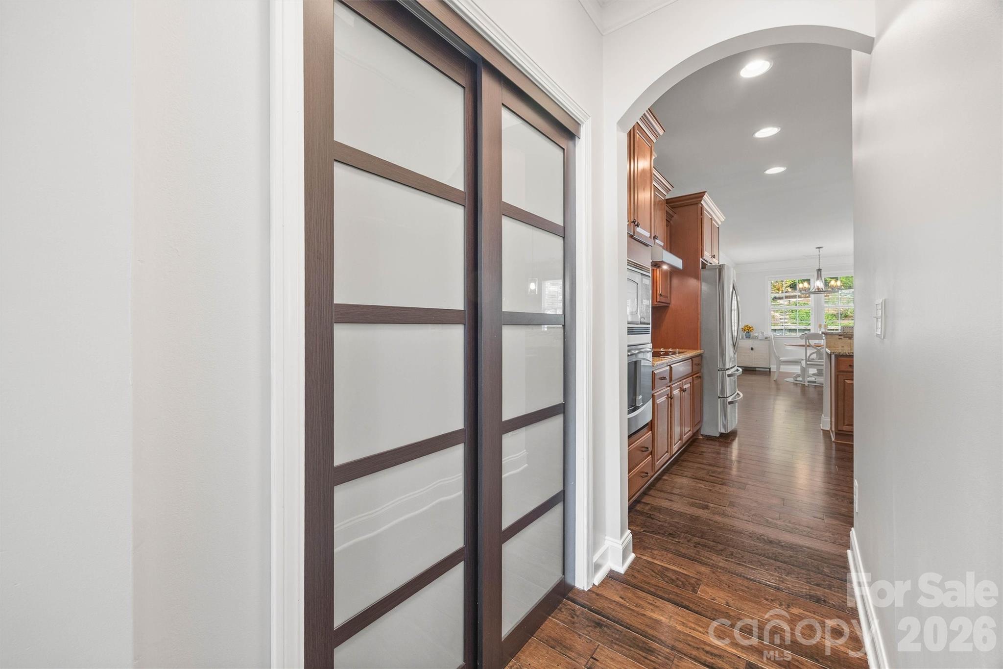 299 Annatto Way Tega Cay, SC 29708 - Photo 8 of 46 a hallway with a large window and a glass door