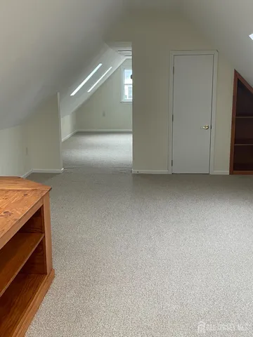 a view of an empty room and fire place