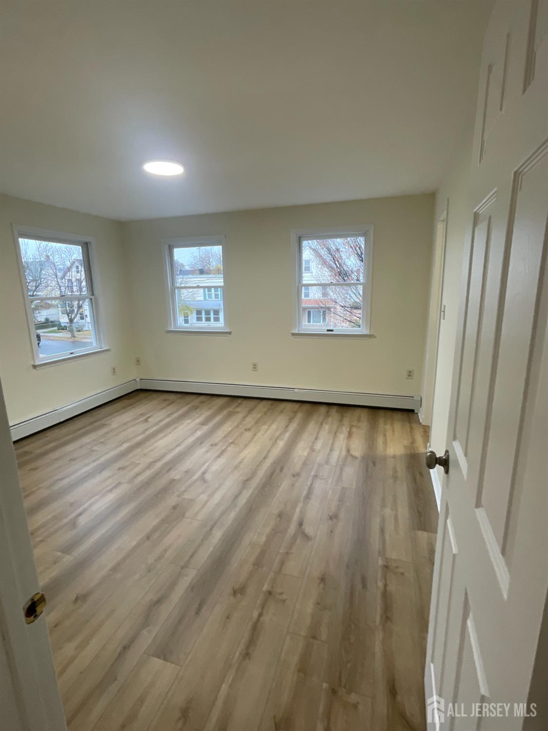351 John Street, Unit 2 South Amboy, NJ 08879 - Photo 3 of 12 a view of room with window and hardwood floor