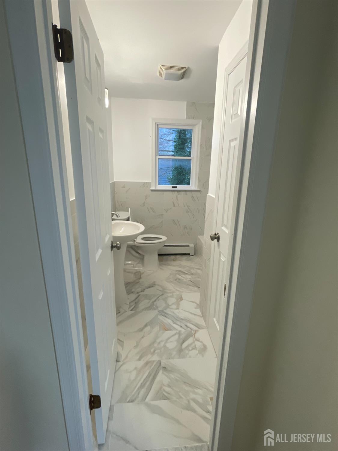 351 John Street, Unit 2 South Amboy, NJ 08879 - Photo 9 of 12 a bathroom with a sink and a mirror
