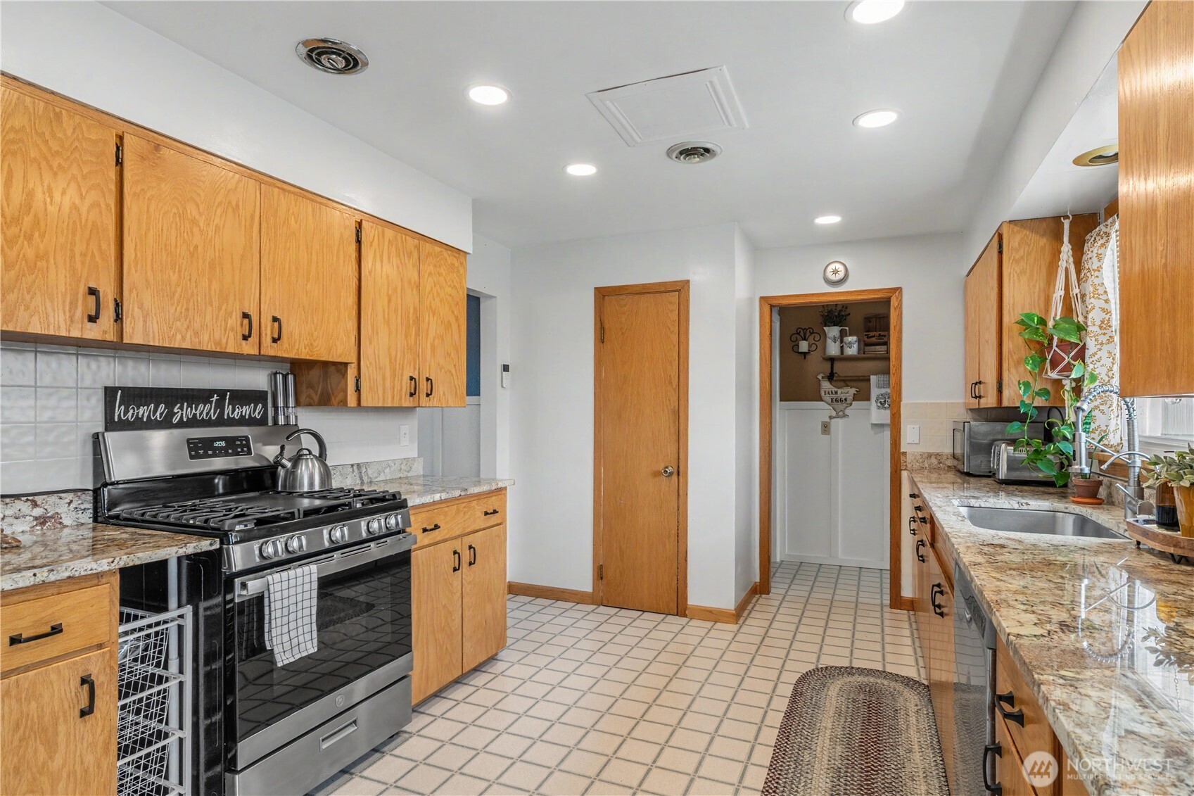 1104 East Dobson Road Odessa, WA 99159 - Photo 8 of 40 a kitchen with stainless steel appliances granite countertop a stove a sink and a refrigerator