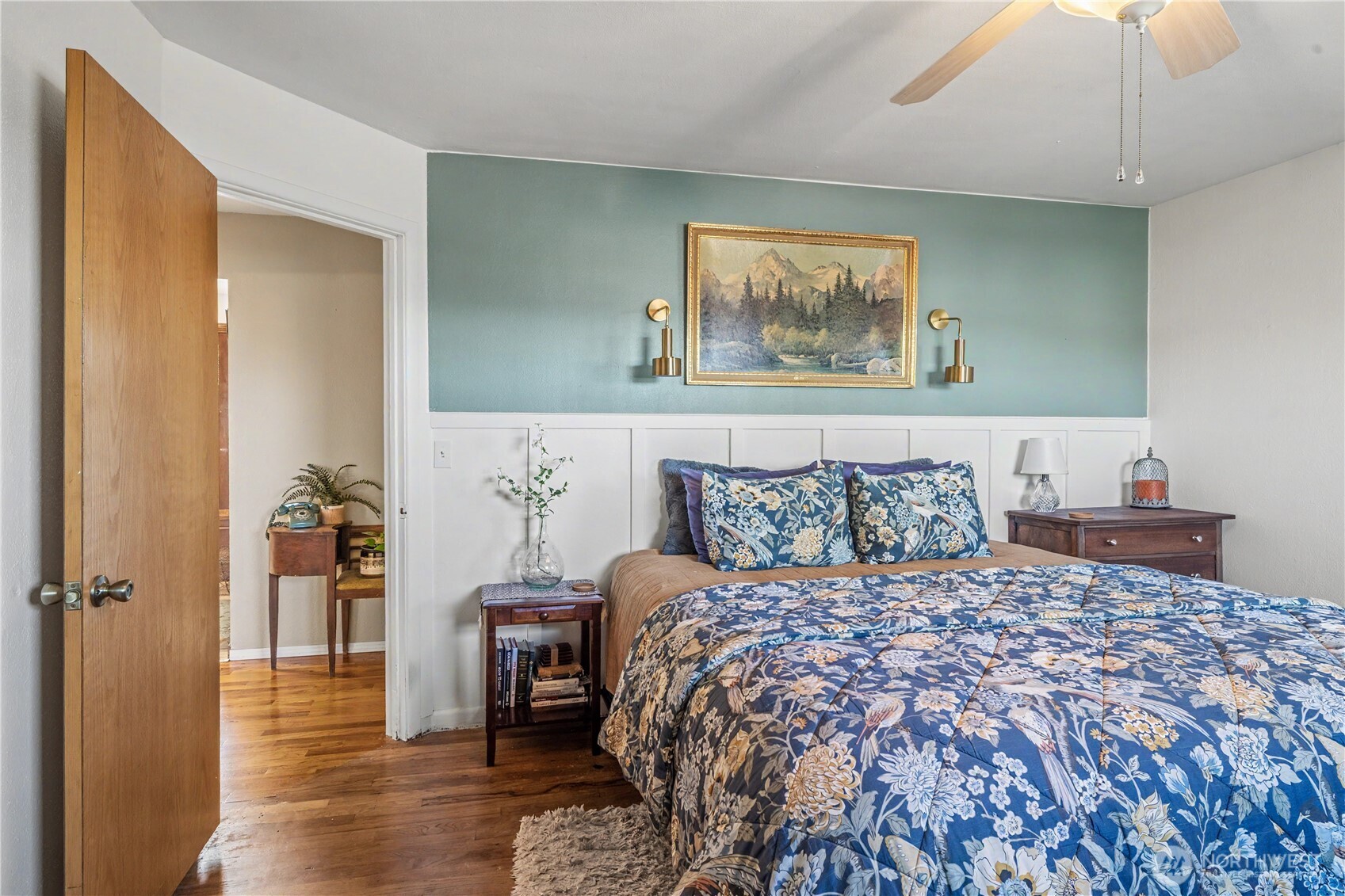 1104 East Dobson Road Odessa, WA 99159 - Photo 10 of 40 a bedroom with a large bed and a chandelier