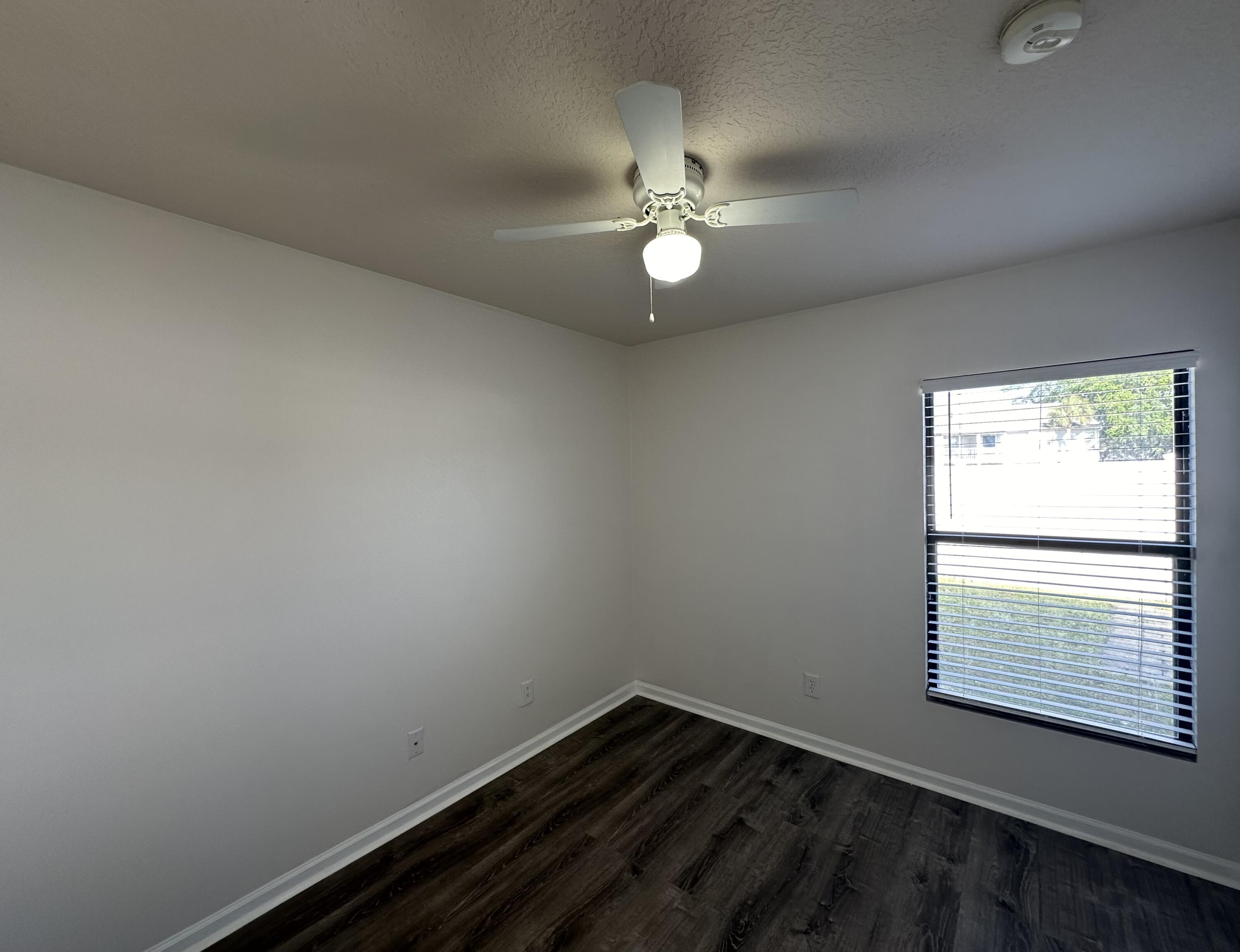 910 Luminary Circle, Unit 103 Melbourne, FL 32901 - Photo 12 of 31 a view of an empty room with a window