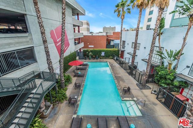 a view of cars parked in front of a building