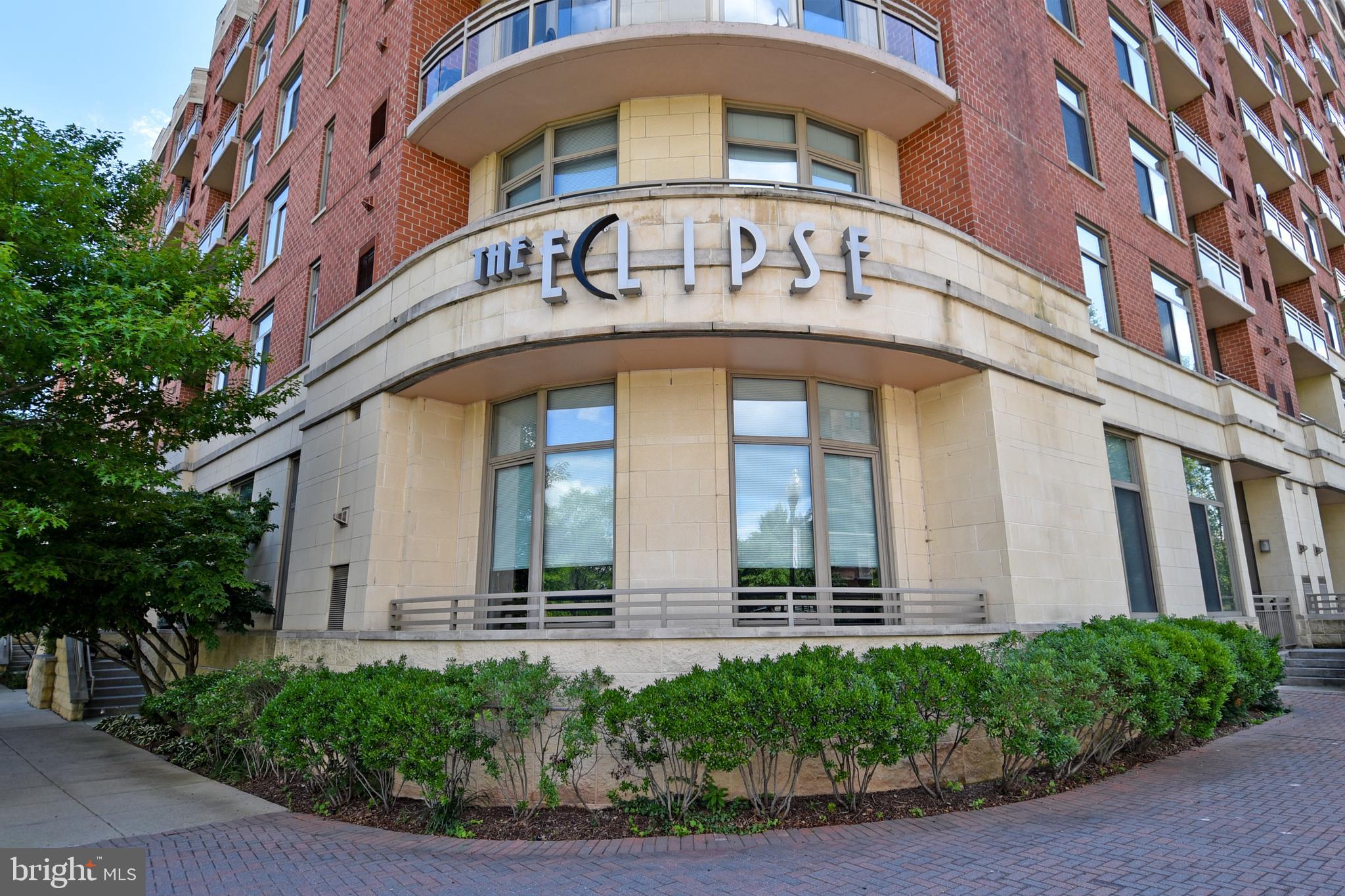 a front view of a building with garden