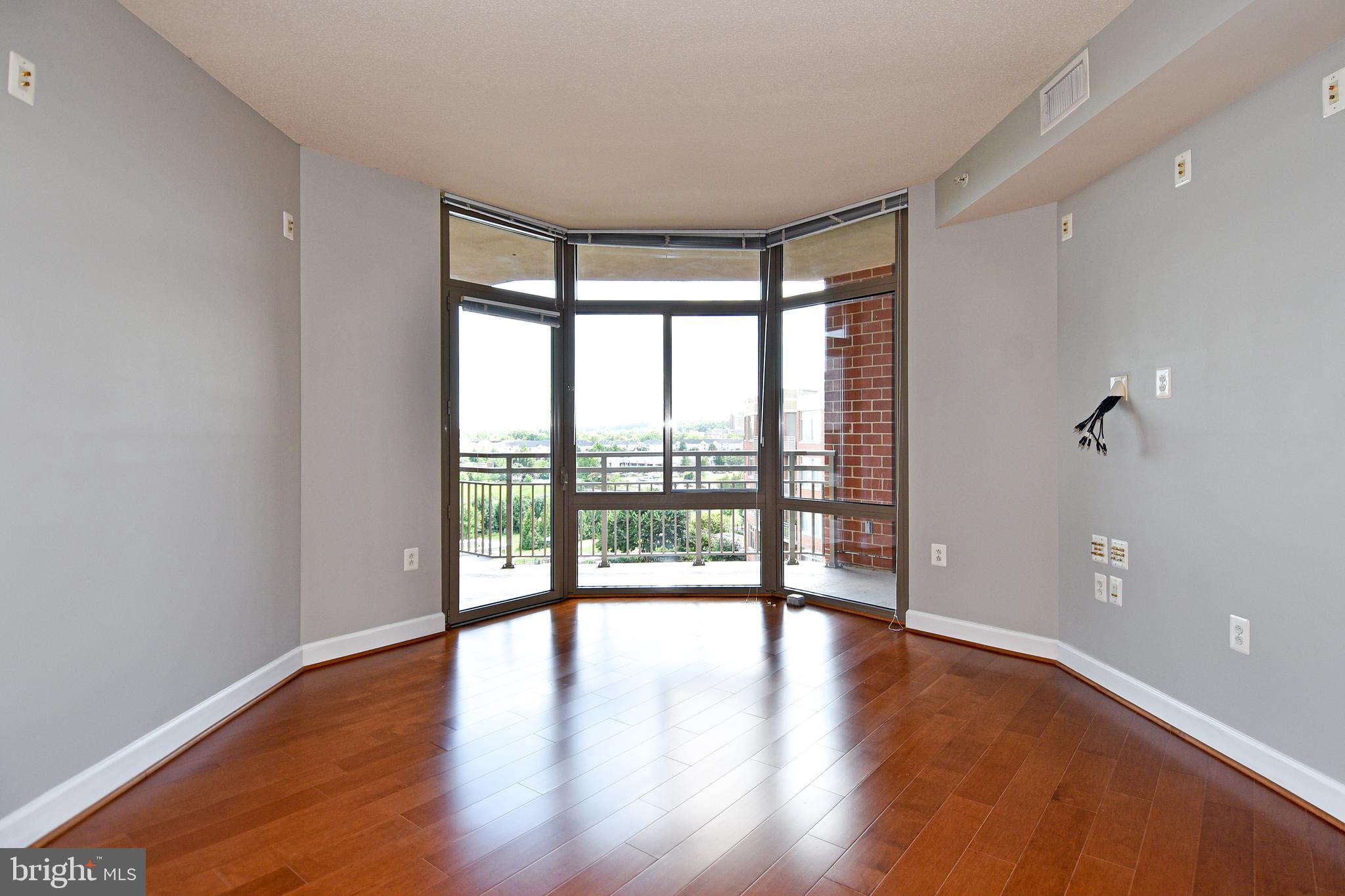 3650 South Glebe Road, Unit 662 Arlington, VA 22202 - Photo 16 of 63 wooden floor in an empty room with a window