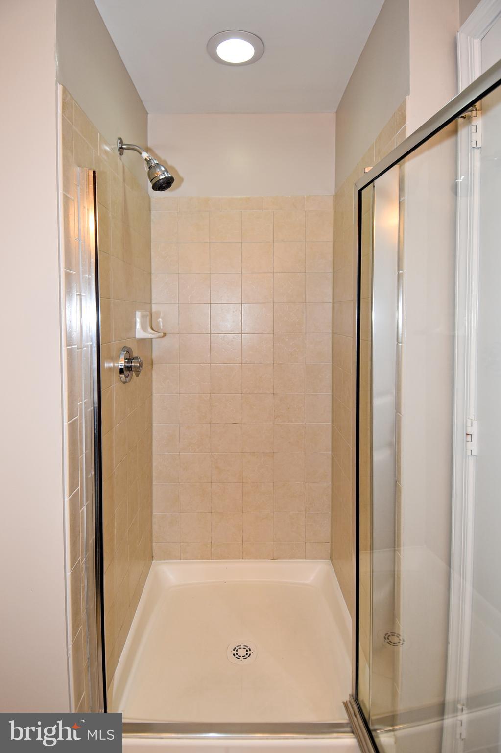 3650 South Glebe Road, Unit 662 Arlington, VA 22202 - Photo 24 of 63 a bathroom with a glass shower door