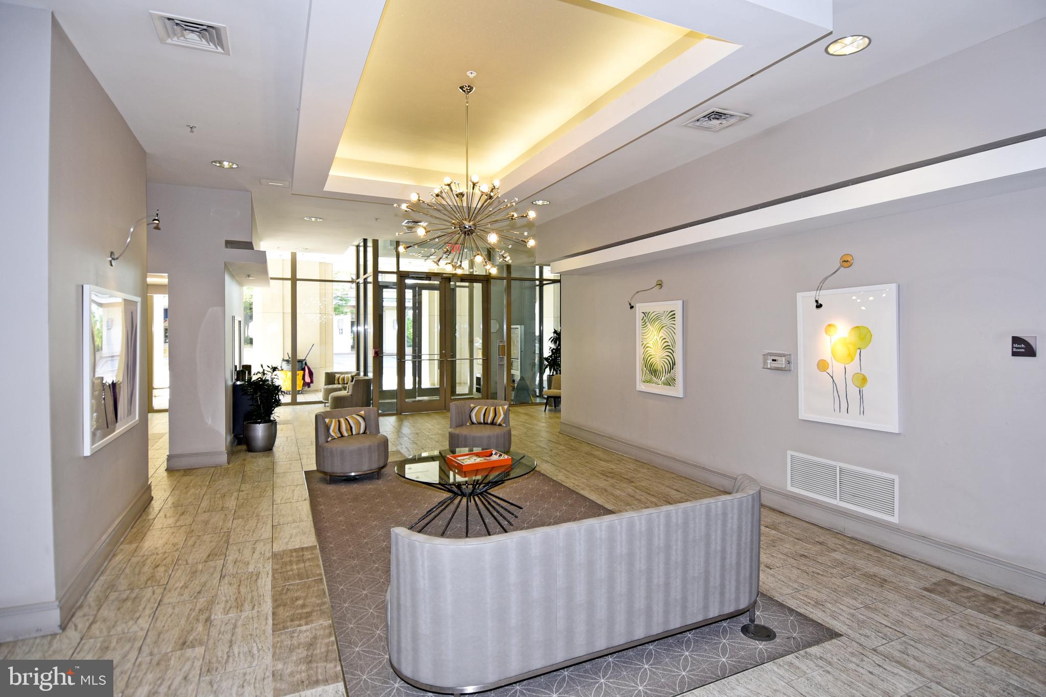 3650 South Glebe Road, Unit 662 Arlington, VA 22202 - Photo 60 of 63 a living room with furniture and a chandelier