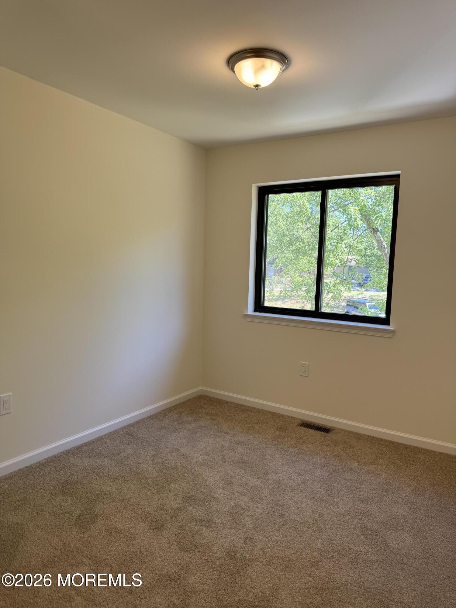 5 Canary Circle Howell, NJ 07731 - Photo 18 of 32 an empty room with a window