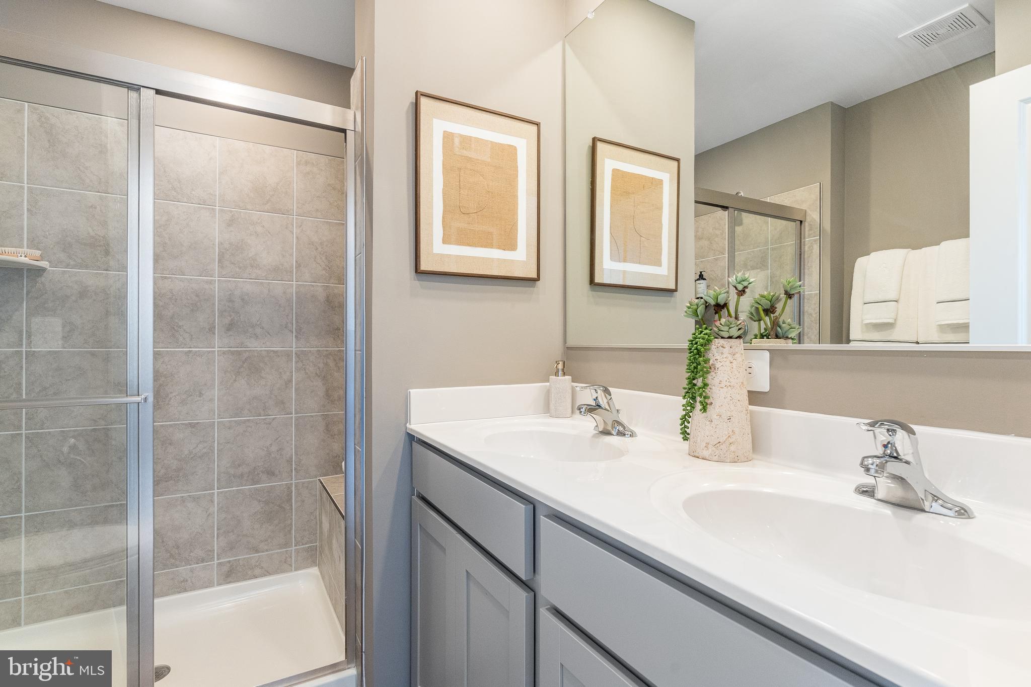335 Sandy Btm Circle Ranson, WV 25438 - Photo 14 of 20 a bathroom with a sink and a mirror