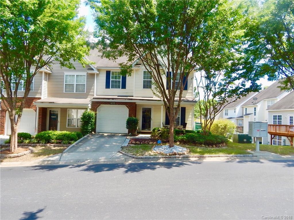 16720 Timber Crossing Road Charlotte, NC 28213 - Photo 1 of 33 a front view of a house with a yard and trees