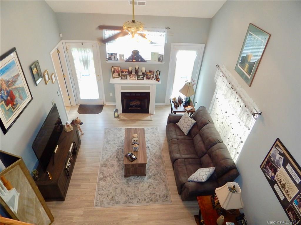 16720 Timber Crossing Road Charlotte, NC 28213 - Photo 22 of 33 a living room with furniture and a fireplace
