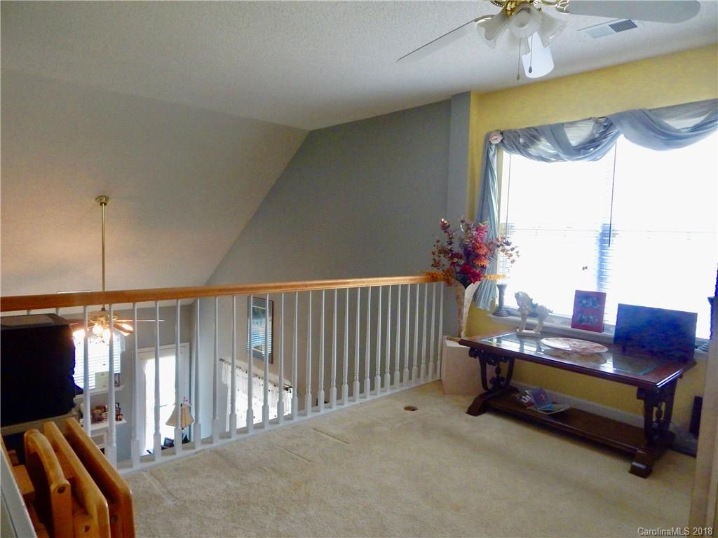 16720 Timber Crossing Road Charlotte, NC 28213 - Photo 23 of 33 a room with furniture and a window