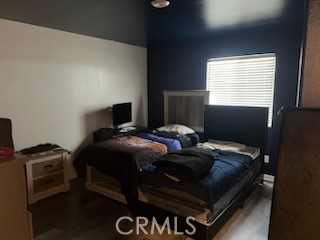 14255 Barolo Way Beaumont, CA 92223 - Photo 17 of 22 a bedroom with a bed and a window
