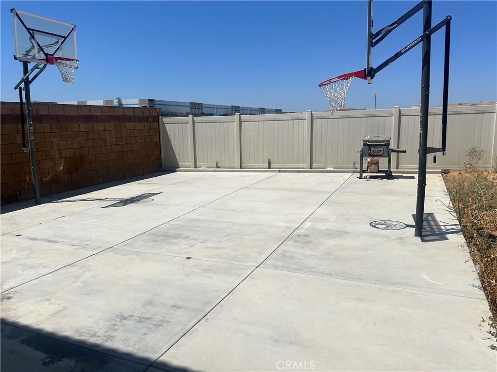 14255 Barolo Way Beaumont, CA 92223 - Photo 18 of 22 a backyard of a house with table and chairs