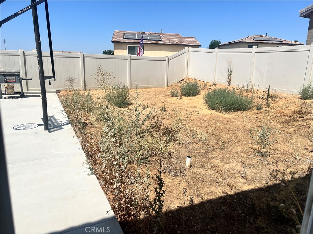14255 Barolo Way Beaumont, CA 92223 - Photo 19 of 22 a view of a backyard of the house